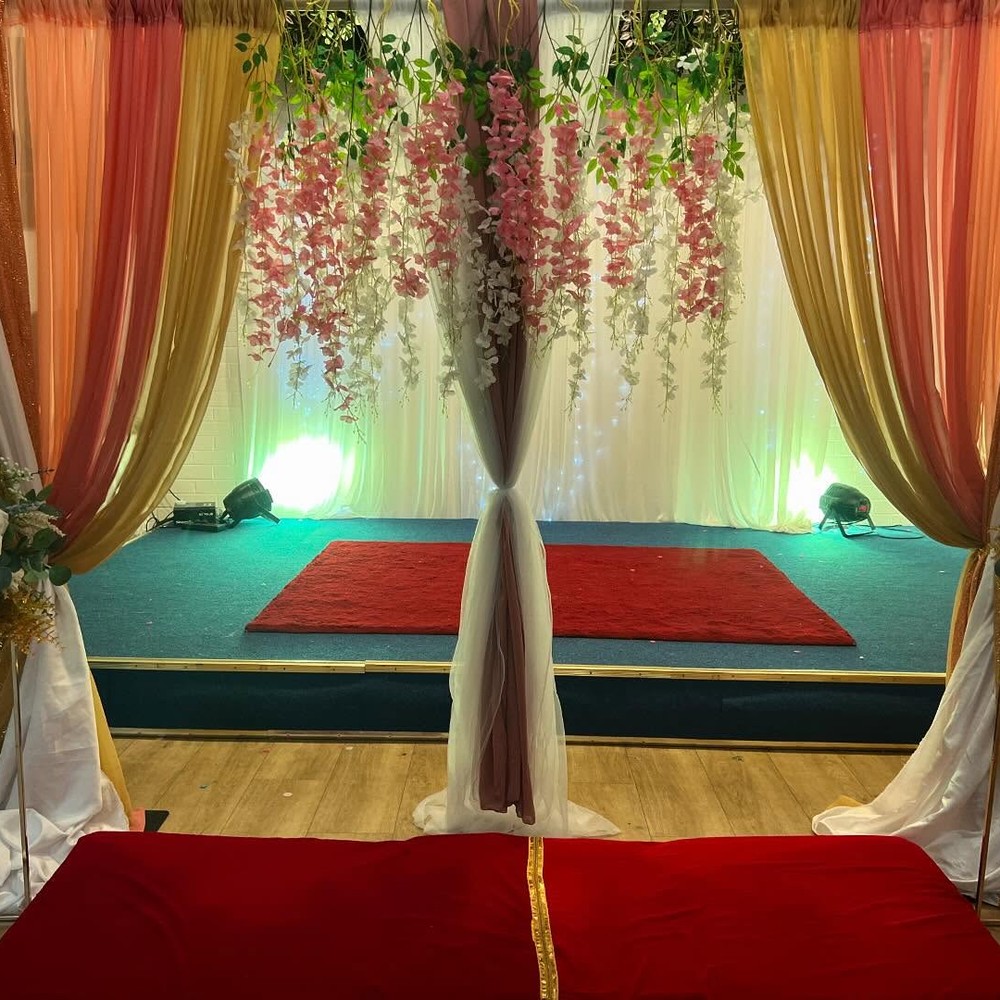 Engagement stage backdrop with hanging floral wisteria