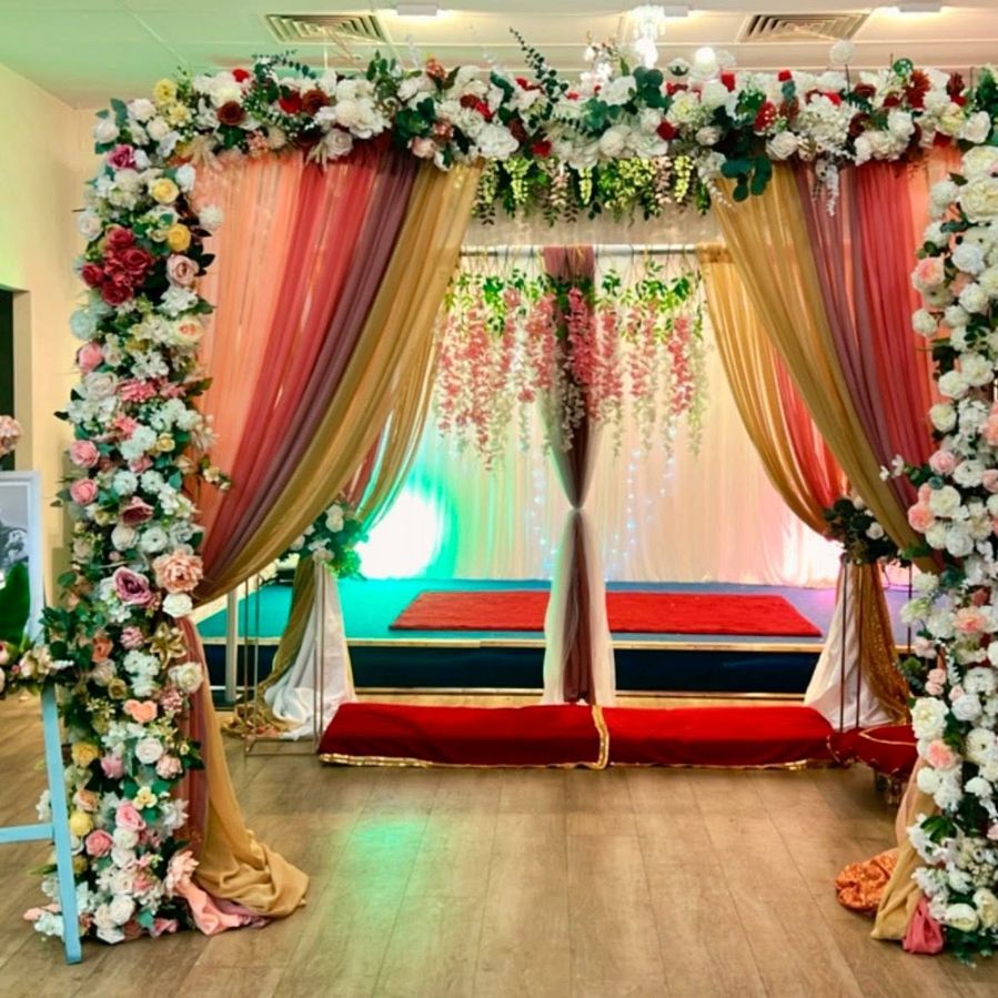 Wedding ceremony arch with white florals